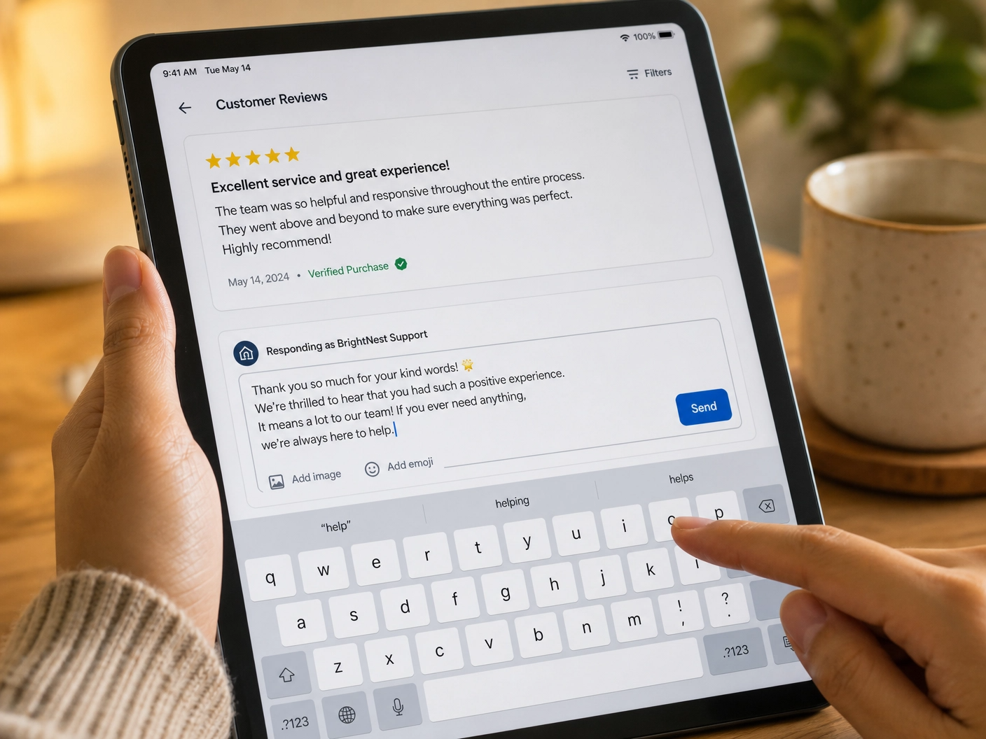 Close-up of a tablet showing a positive Etsy customer review and a seller typing a response.