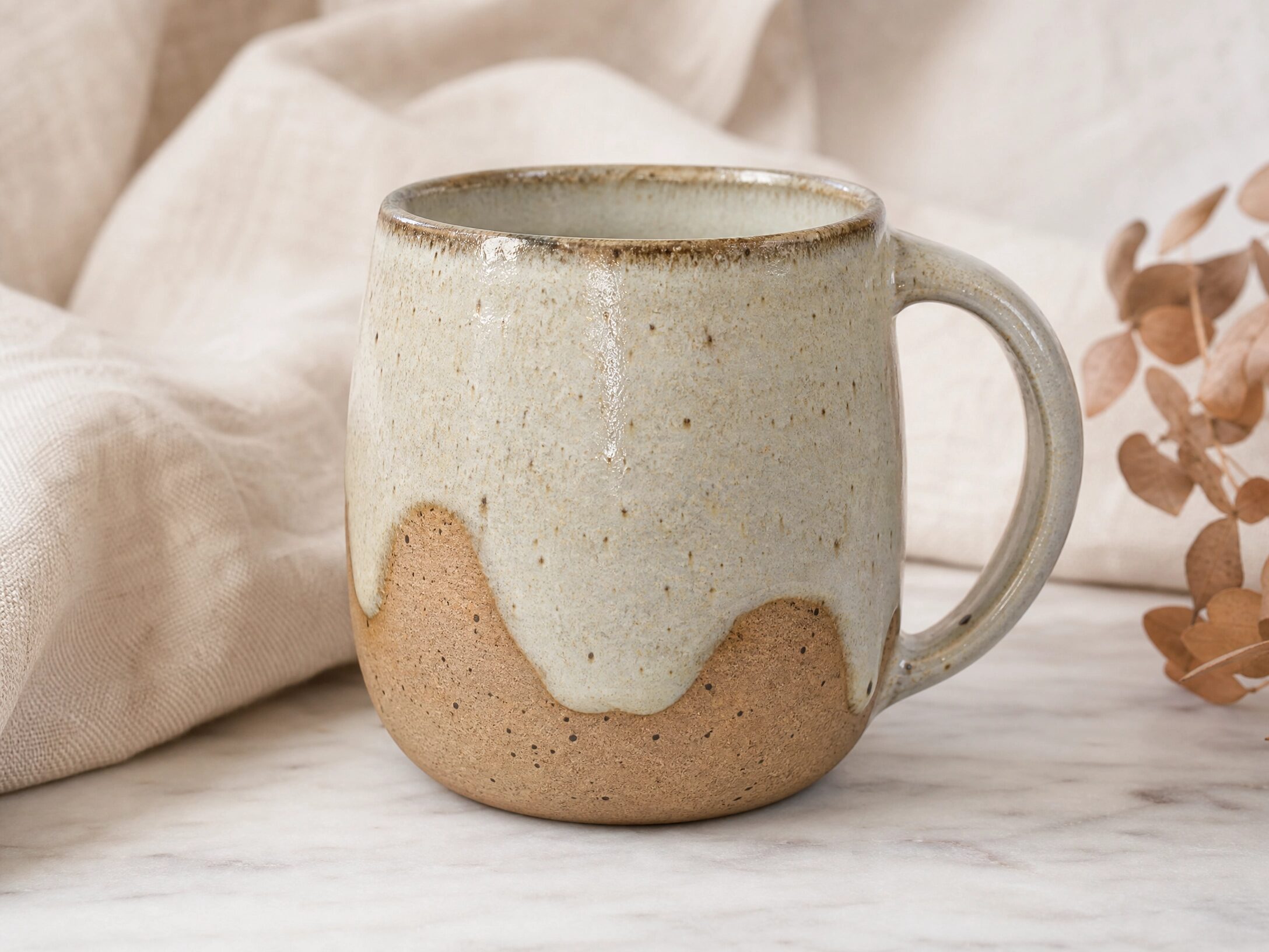 A high-quality, professional close-up of a handcrafted ceramic mug, symbolizing excellent product presentation.Â